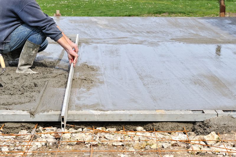 A man levelling a concrete slab
